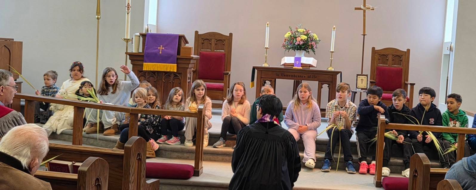 Children gathered at the front of the sanctuary for a children's message